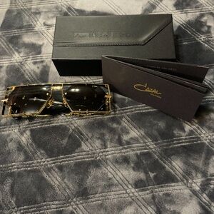 Cazal Designer Sunglasses with Gold Frame and Dark Lenses